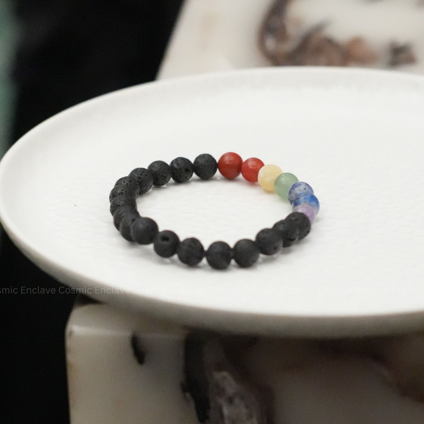 7 Chakra beaded bracelet with colorful beads on a white plate