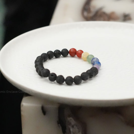 7 Chakra beaded bracelet with colorful beads on a white plate