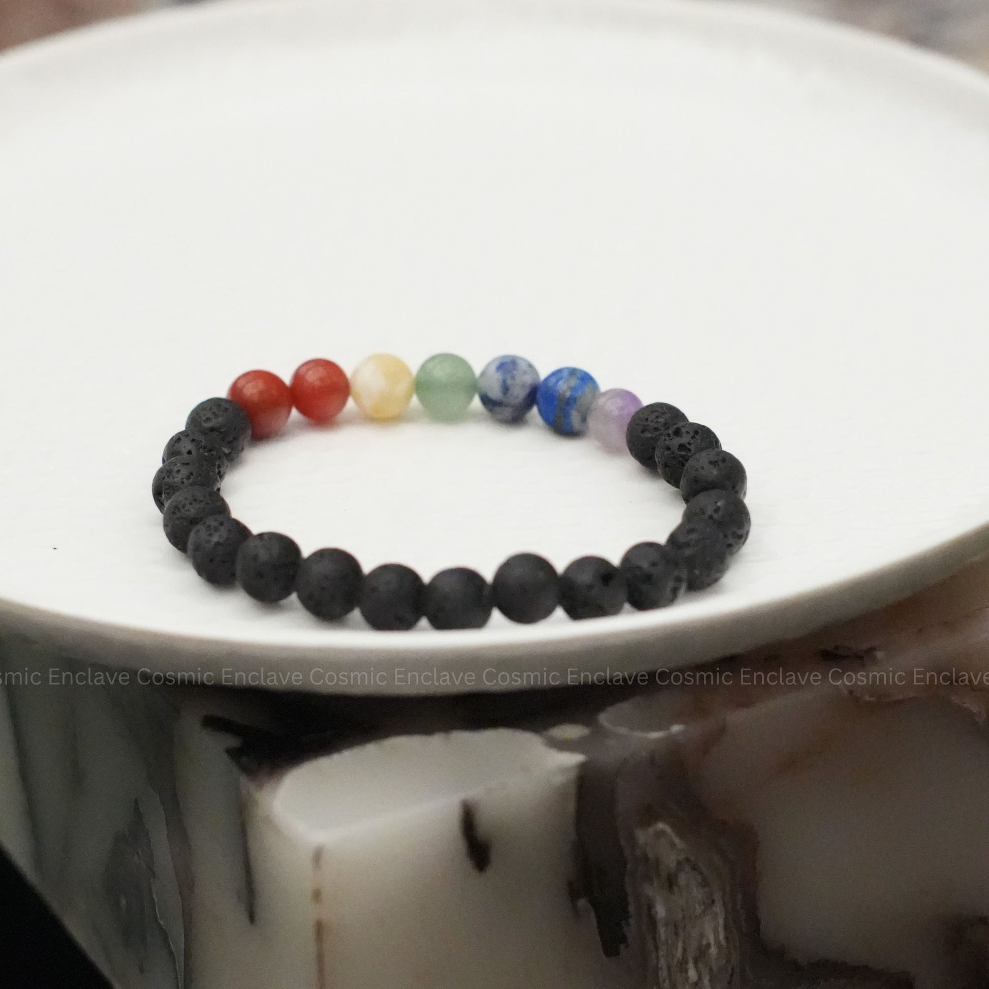 Multicolored 7 Chakra beaded bracelet on a white surface
