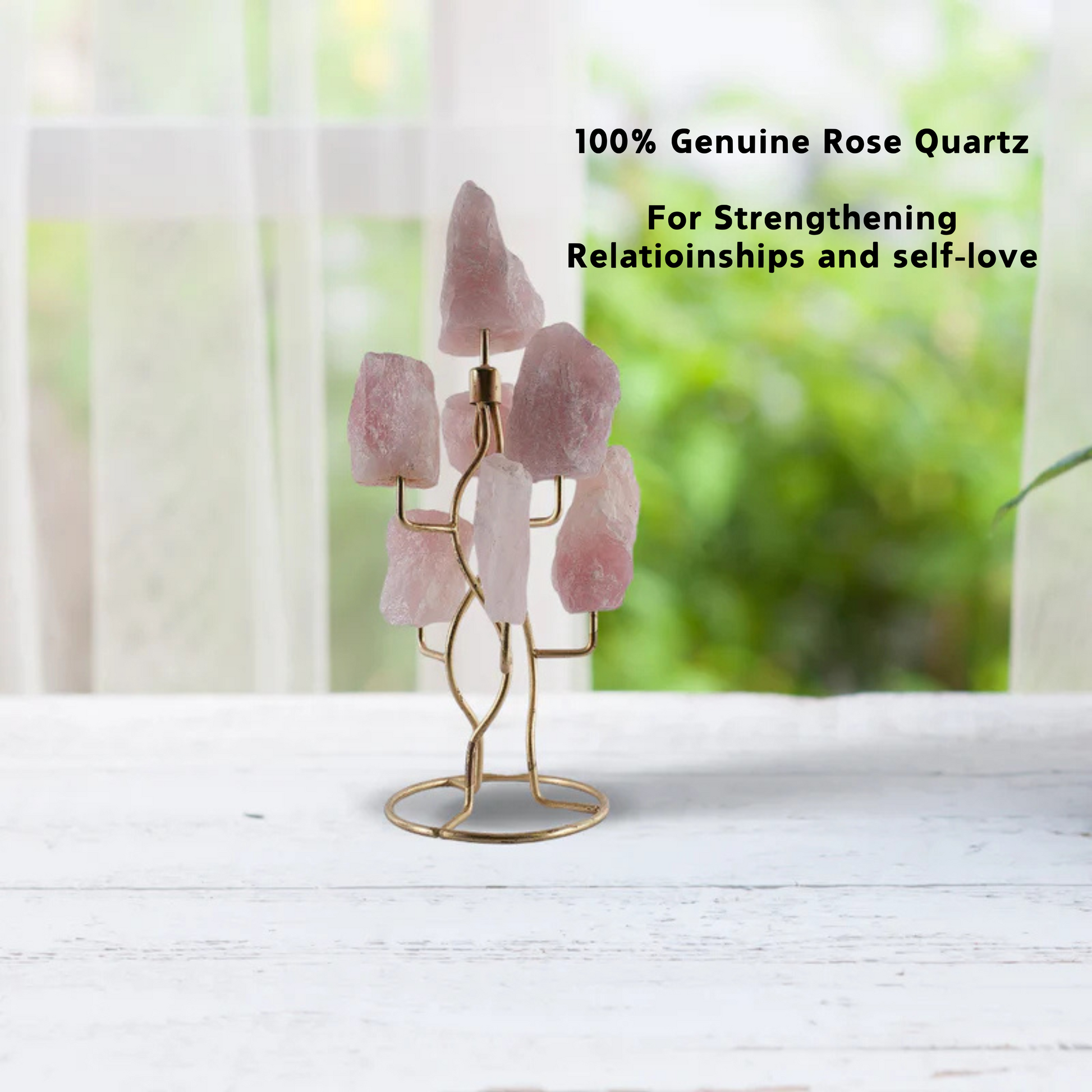 A tree-shaped stand holding raw rose quartz stones.